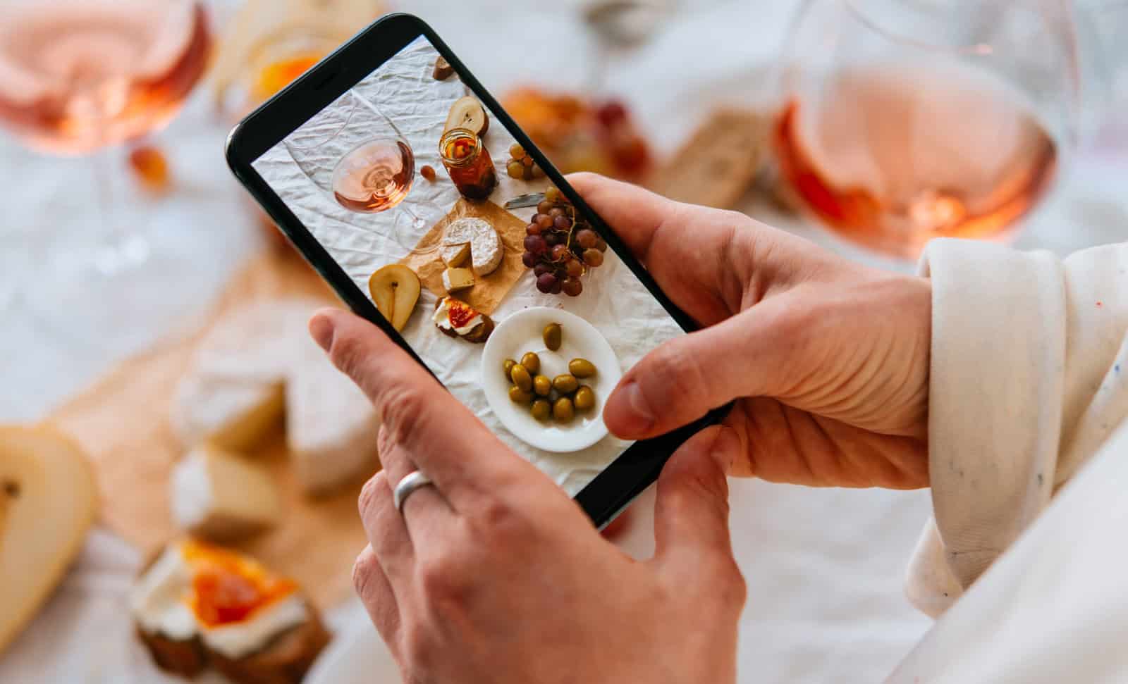 iphone taking photo of cheeseboard