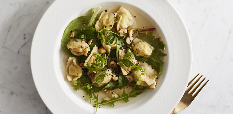 Hazelnut agnolotti with brothy spring greens. Photograph by Evi Abeler