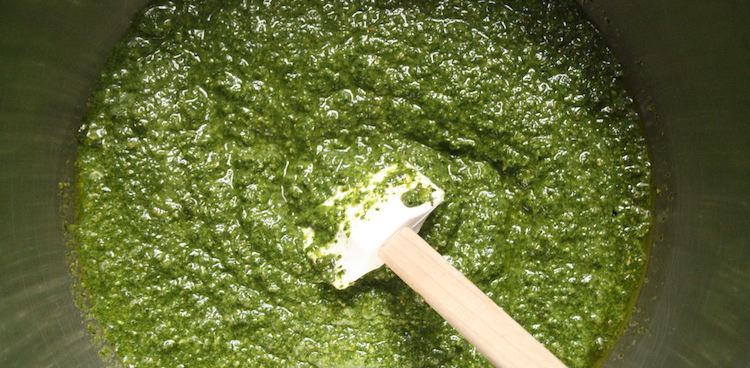 pesto in metal bowl with spatula